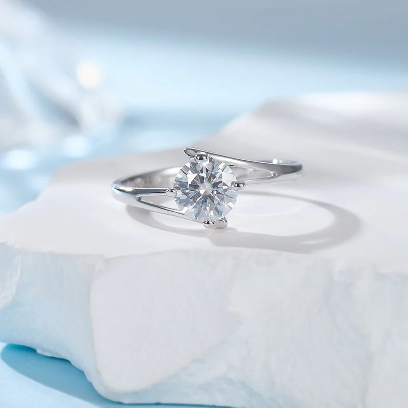 A sterling silver ring with a radiant diamond