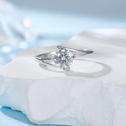 A sterling silver ring with a radiant diamond