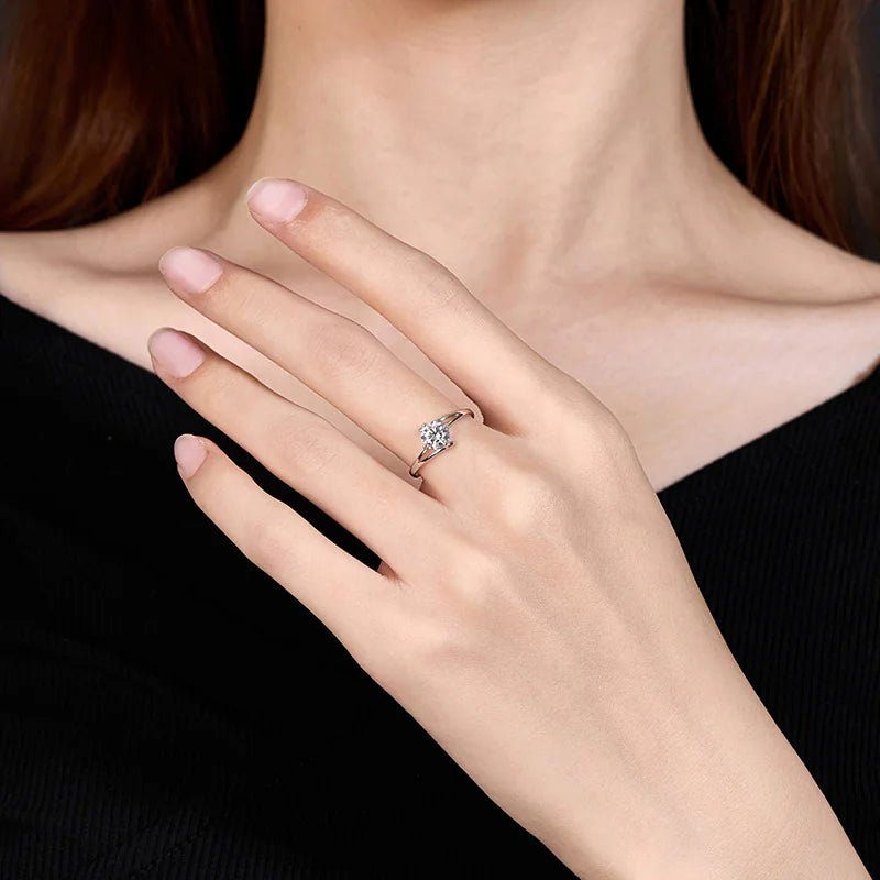 A sterling silver ring with a radiant diamond