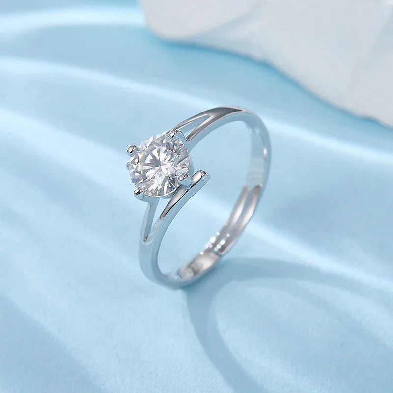 A sterling silver ring with a radiant diamond